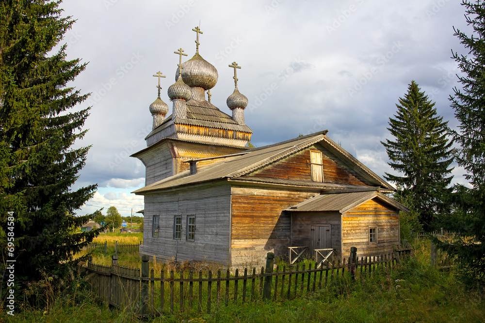 traditional old wooden church behind the fence traditional old wooden church behind the fence