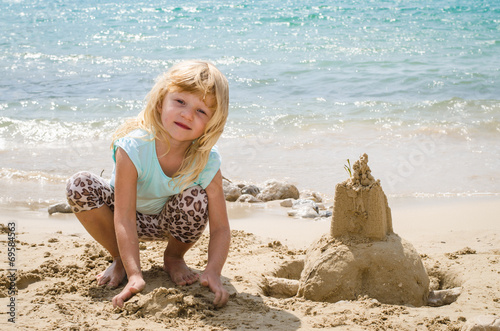 child building a sand castle