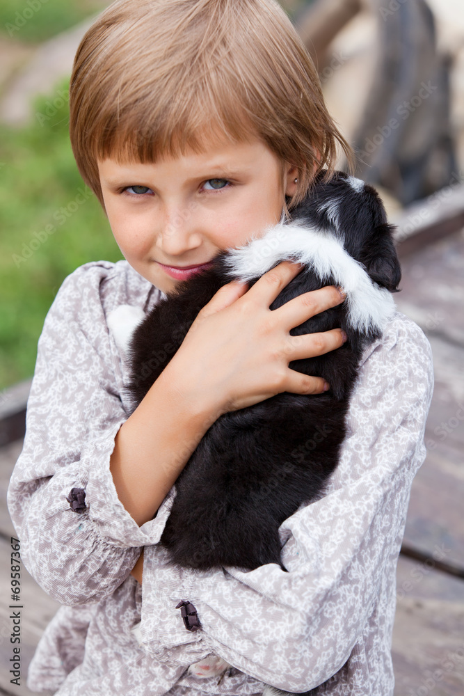 Little girl with the puppy