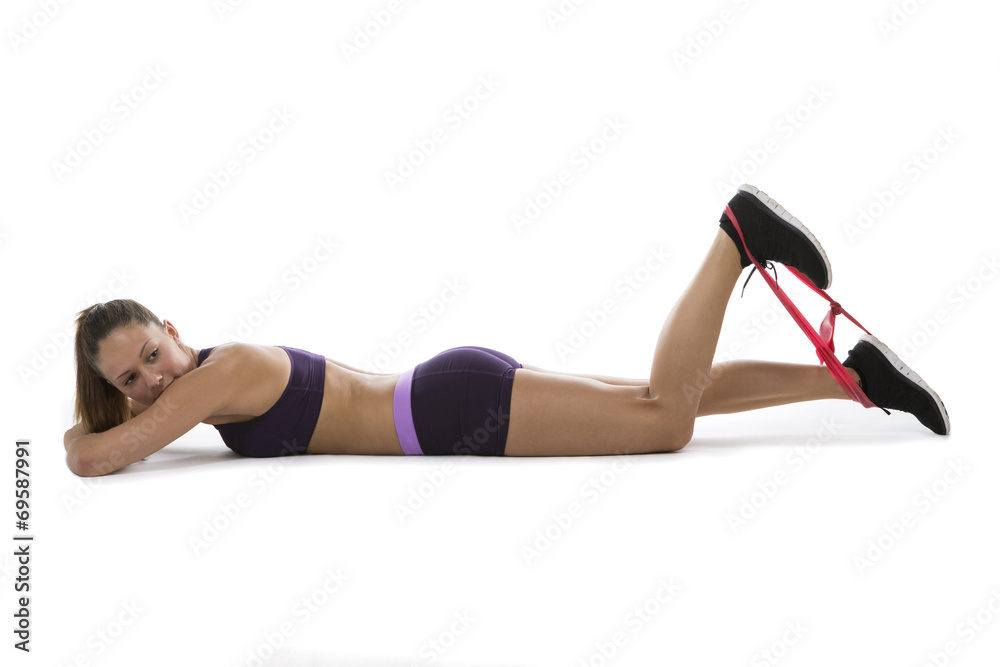 Young woman exercising with a strap