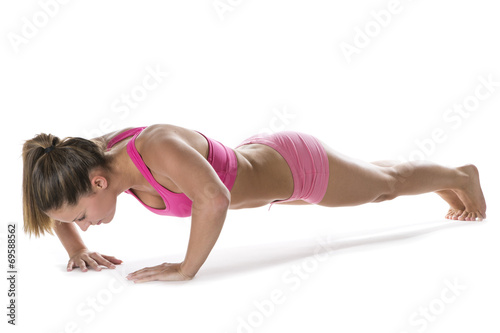 Fit young woman doing press-ups