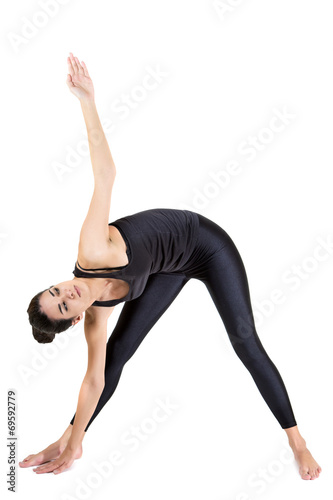 Pretty young woman training yoga