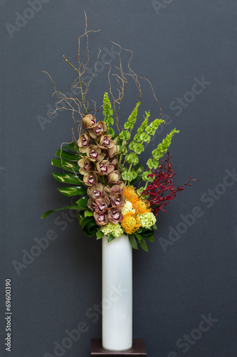Floral arangement with Cymbidium, Hydrangea, Orchids, moluccella photo