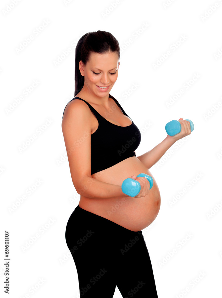 Brunette pregnant woman training with dumbbells Brunette pregnant woman training with dumbbells