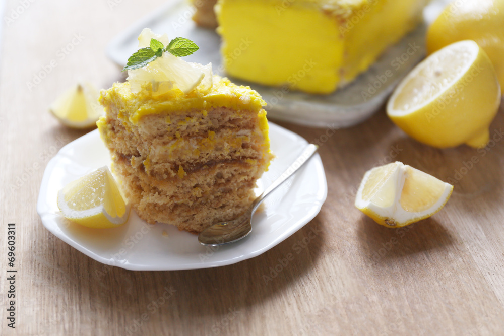 Tasty lemon dessert on wooden table Tasty lemon dessert on wooden table