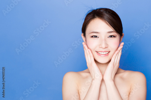 beautiful asian woman on blue background