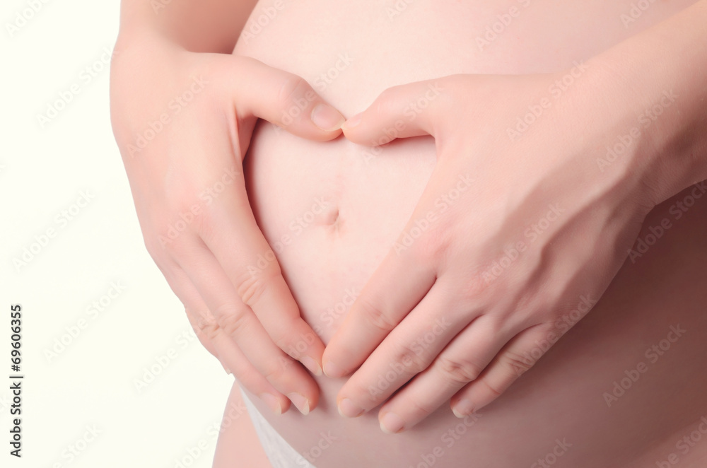 custom made wallpaper toronto digitalPregnant Woman holding her hands in a heart shape on her baby bu