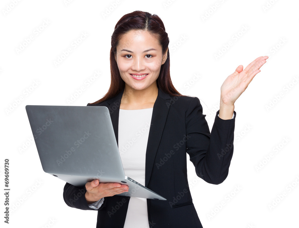 Businesswoman hold laptop and hand presentation Businesswoman hold laptop and hand presentation