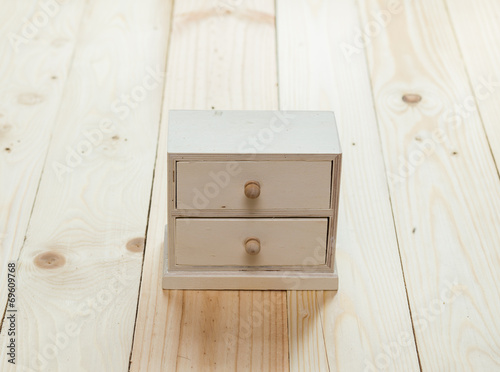 drawers on wooden background