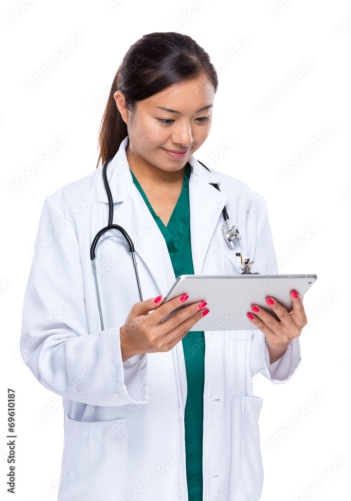 Female medical doctor look at the digital tablet Female medical doctor look at the digital tablet