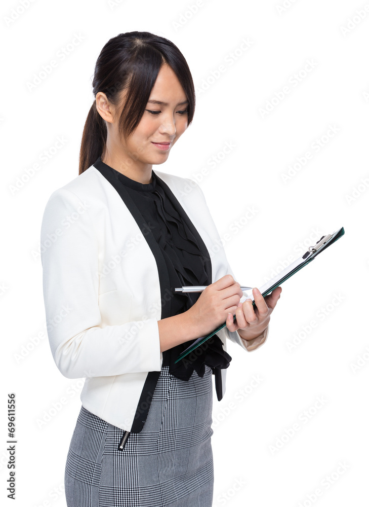 Business executive write on clipboard Business executive write on clipboard