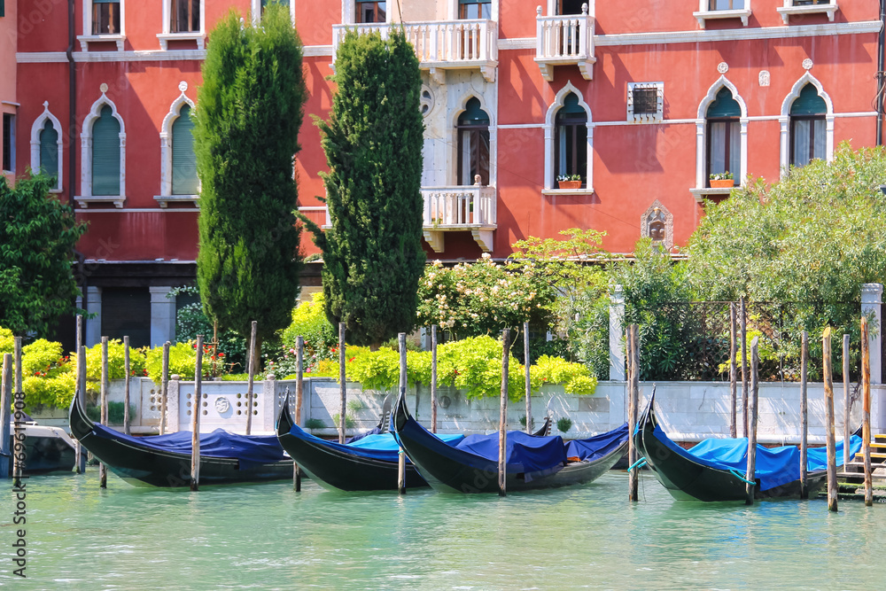 Gondolas at berth of the Grand Canal near the picturesque mansio