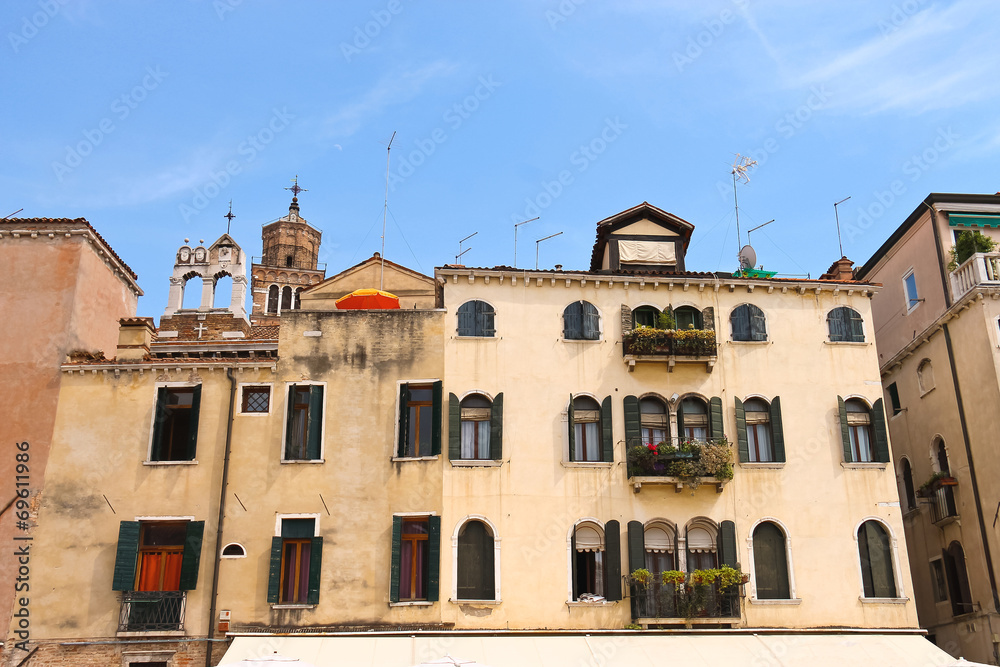 Picturesque Italian house on a background of Church Santa Maria