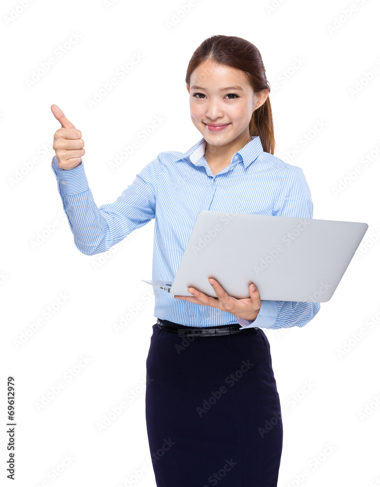 Businesswoman use laptop computer and thumb up Businesswoman use laptop computer and thumb up