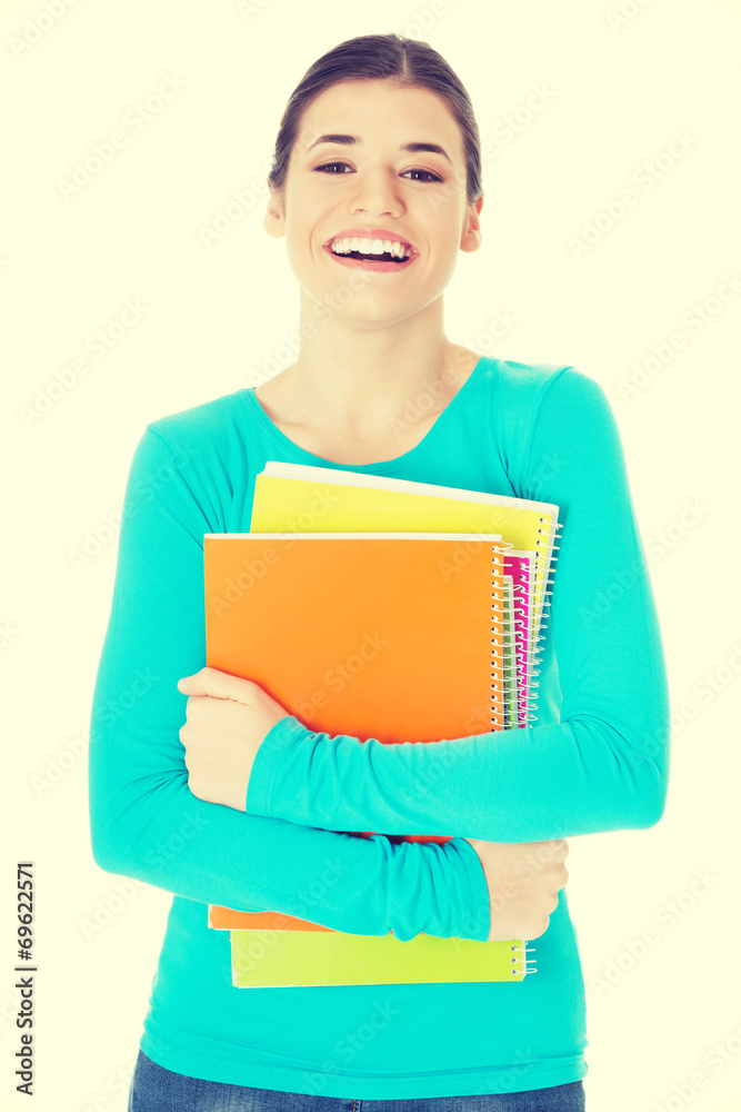 Beautiful young woman student with workbook. Beautiful young woman student with workbook.