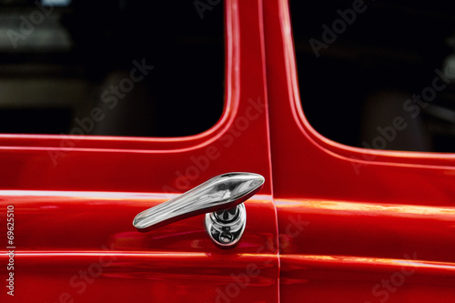 Silver door handles vintage red car