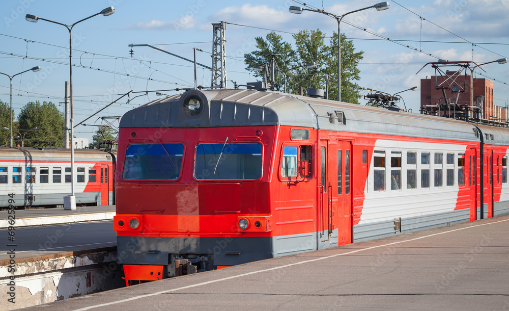 Modern red suburban electric train standing at the station in Ru