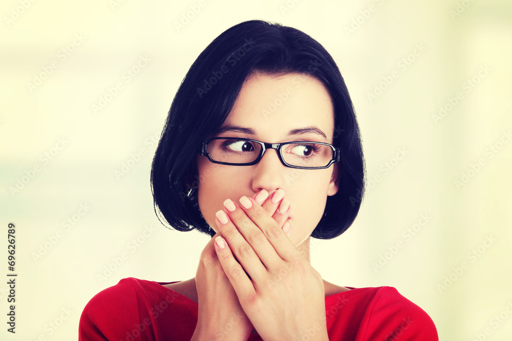 Shocked woman covering her mouth with hands