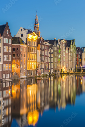 Photography The Damrak canal in Amsterdam, Netherlands.