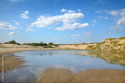 Marsh after sand excavation  landscape with beautiful sky