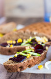 vegetarian sandwich with vegetables on a wooden background