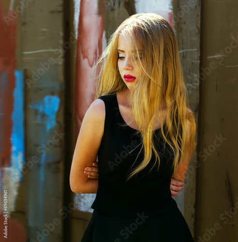 Hipster style. Fashion portrait of beautiful blond-haired girl i