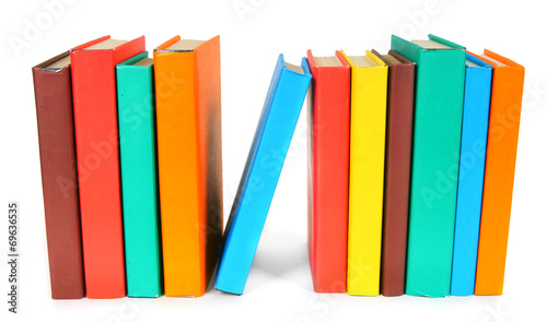 Multi-coloured books. On white background.