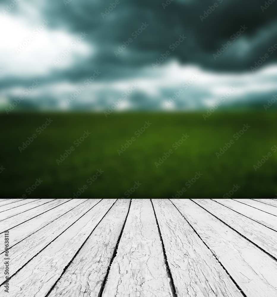 Fresh spring green grass with green bokeh and sunlight and wood Fresh spring green grass with green bokeh and sunlight and wood