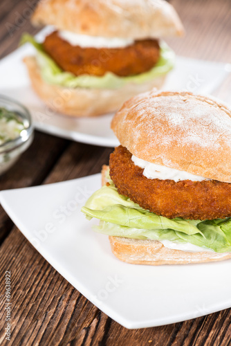 Homemade Fishburger on wooden background