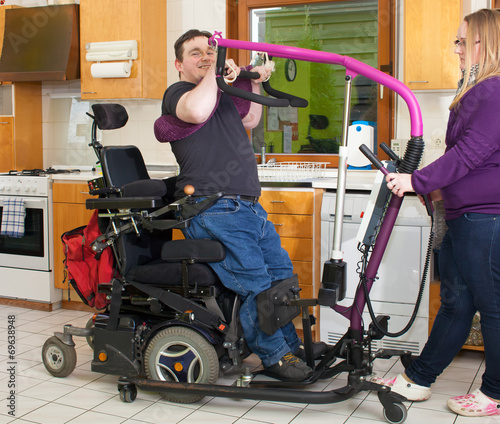 Therapist helping a young cerebral palsy patient.