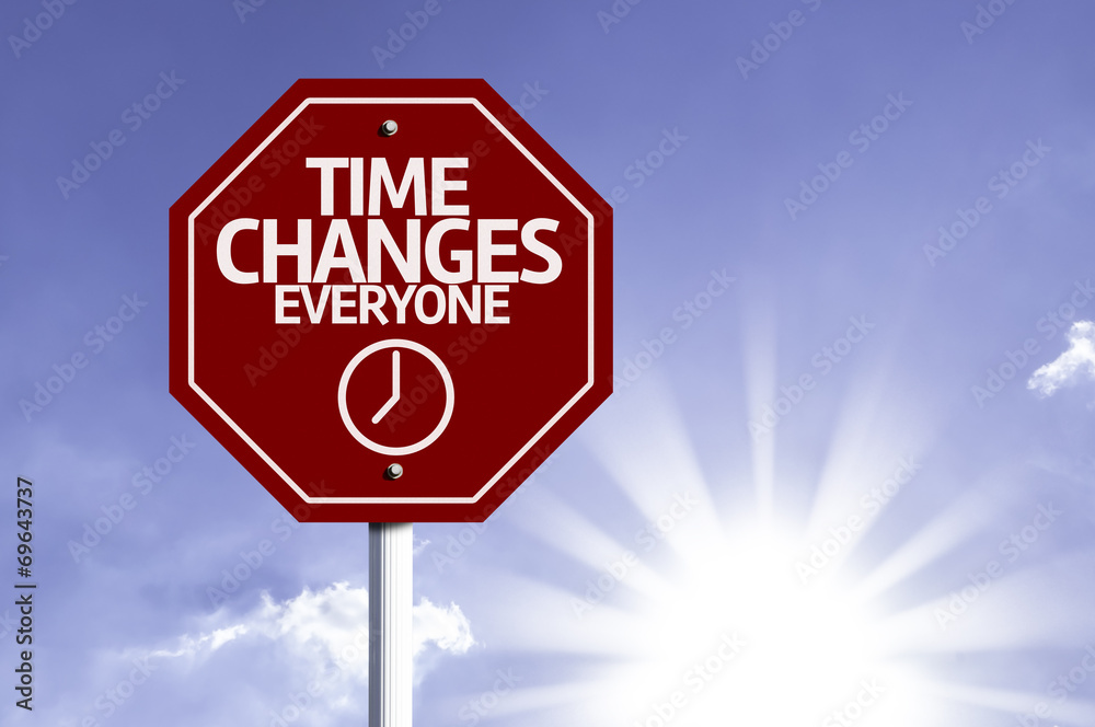 Time Changes Everyone red sign with sun background Time Changes Everyone red sign with sun background