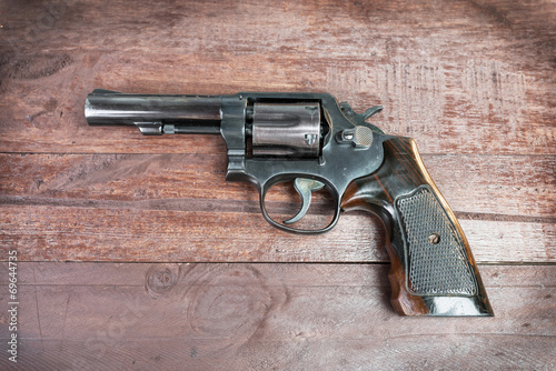 Black revolver gun isolated on white background