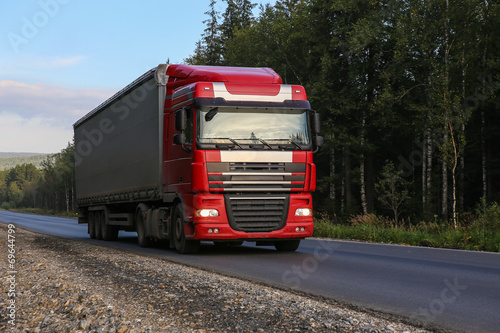 truck with trailer goes on the highway © Yuri Bizgaimer