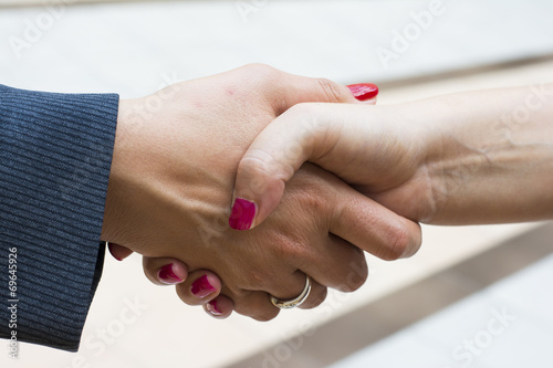 Handshake of two women