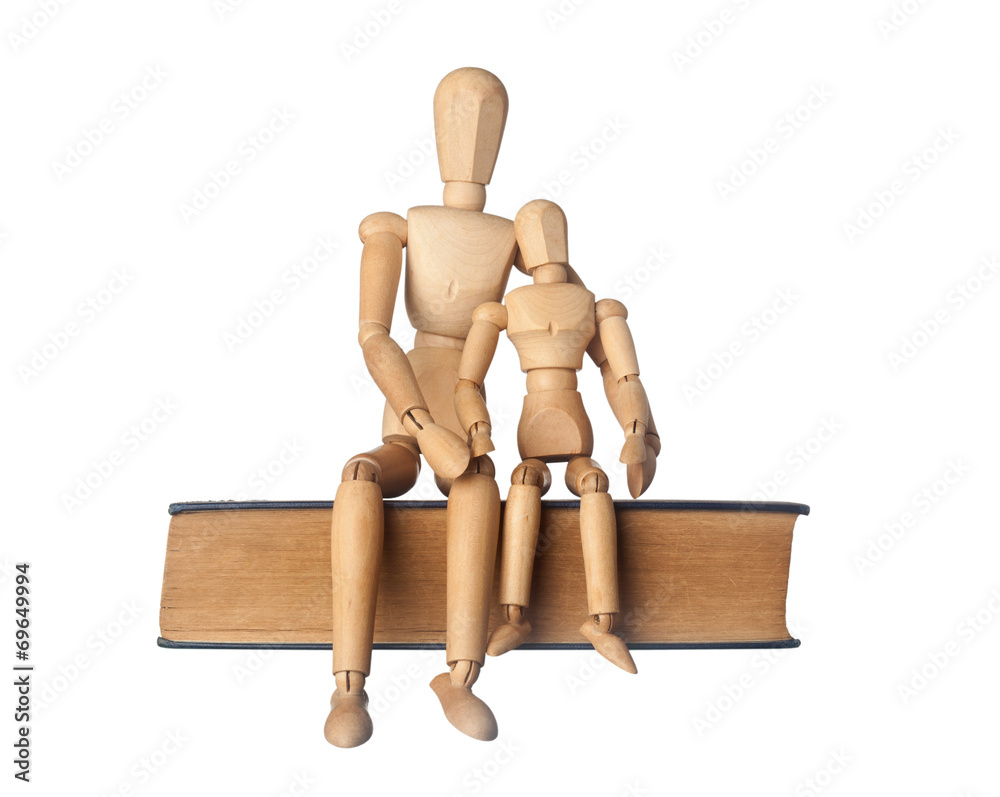 Parent and child figurines sitting next to each other isolated Parent and child figurines sitting next to each other isolated