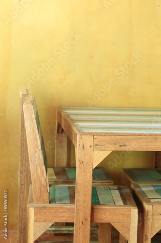 table wood in yellow room with mortar wall