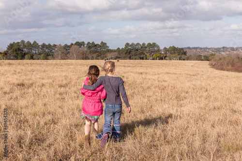 Young Girls Together Walking Grass Field
