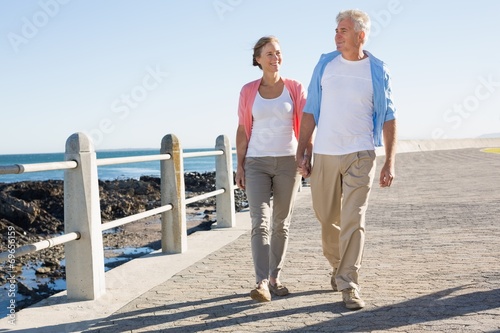Fényképezés Happy casual couple walking by the coast