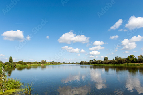 River with clouds reflection