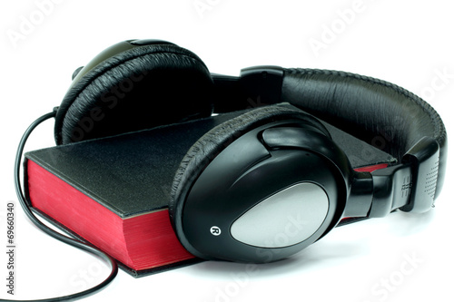 Bible and headphones on white background