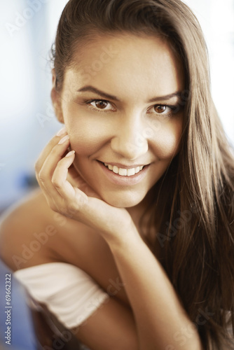 Close-up face portrait of young woman without make-up. Natural i