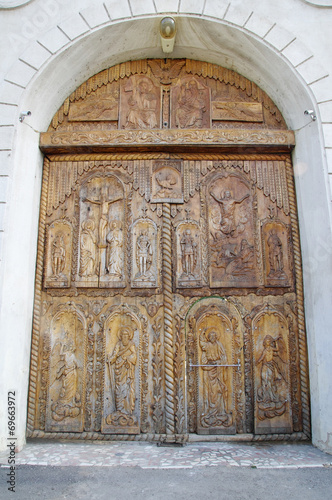 Wooden door on Cocos Monastery,  Dobrogea , Romania photo