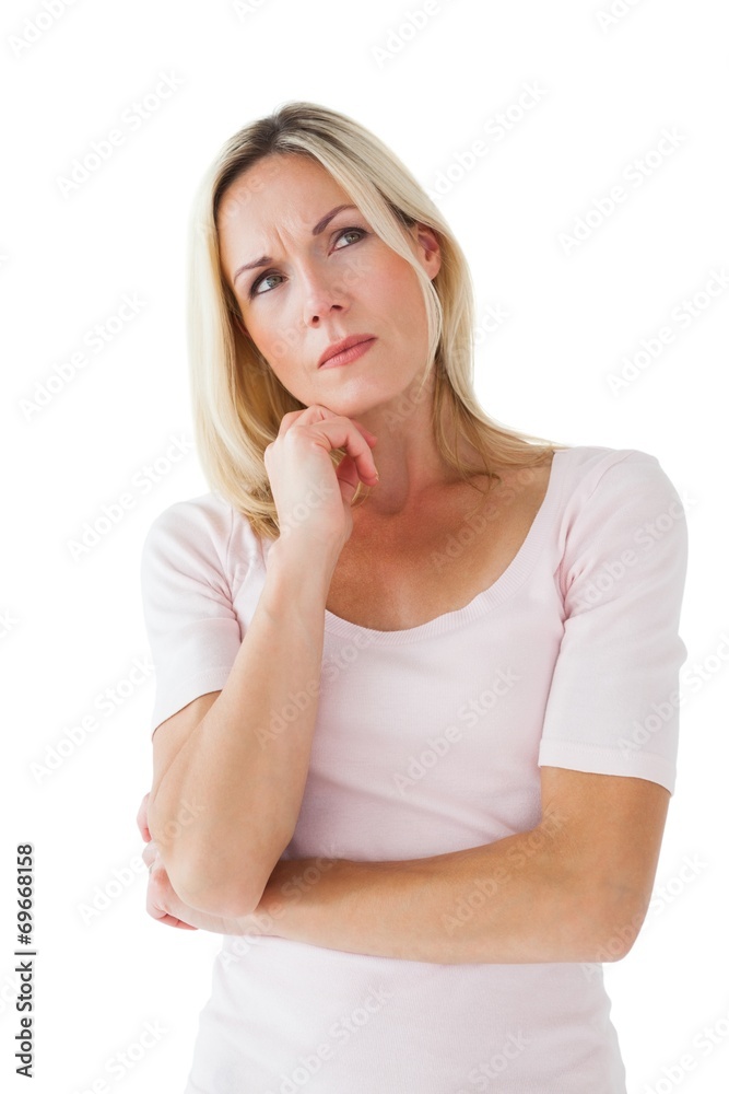 Serious blonde thinking with hand on chin Serious blonde thinking with hand on chin