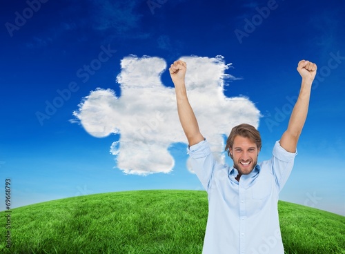 Composite image of happy man celebrating success with arms up