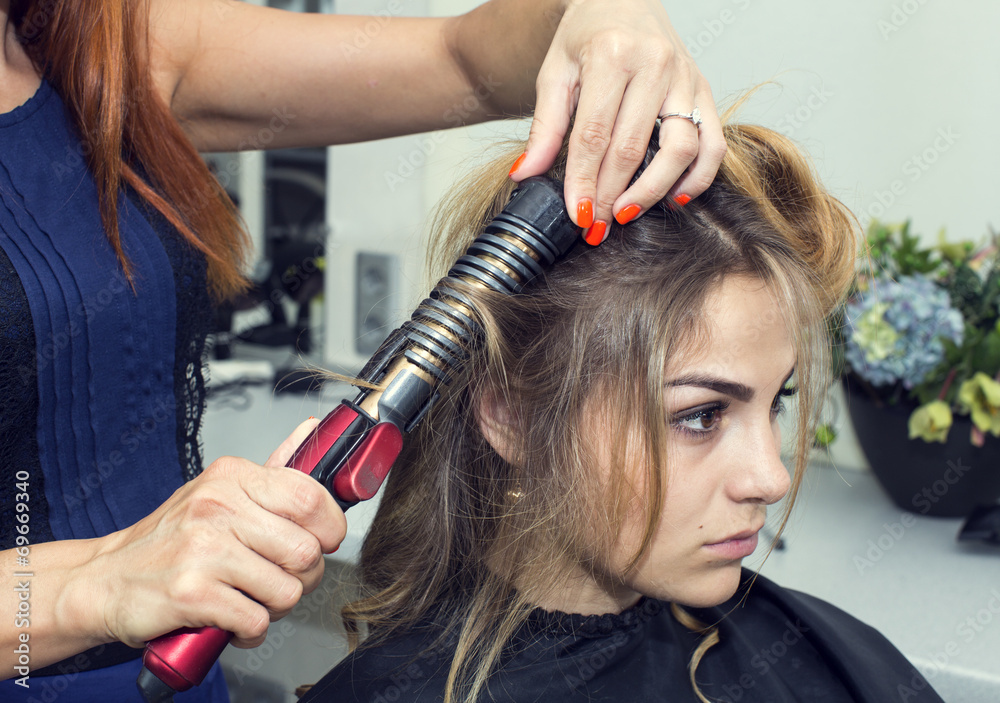 woman in a beauty salon doing hair woman in a beauty salon doing hair