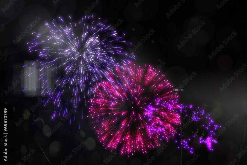Obraz premium Colourful fireworks exploding on black background