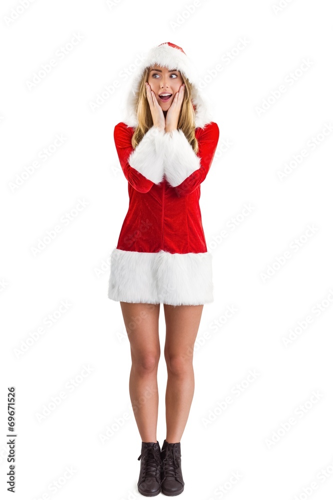 Pretty santa girl with hands on face