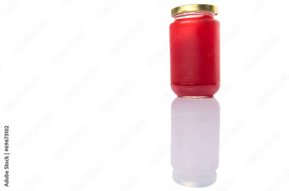 A bottle of strawberry jam over white background A bottle of strawberry jam over white background