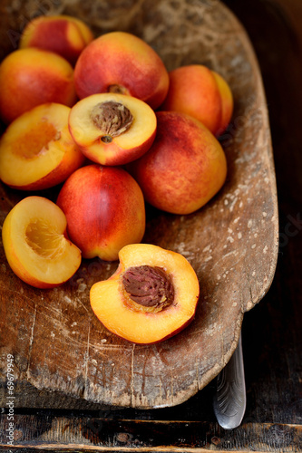 nectarines in an old wooden bucket
