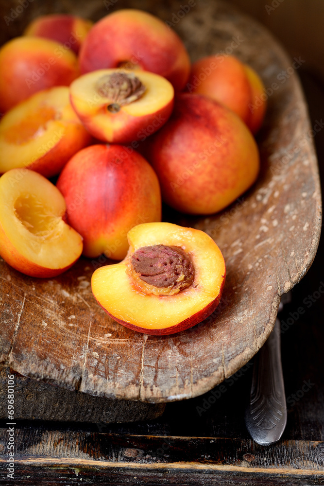 nectarines in an old wooden bucket